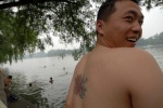 China, The many faces of Beijing. Li Kaye with his friends like to swim at lake. It is used from all ages.
 © Maro Kouri