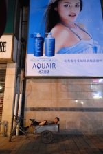 China, The many faces of Beijing

A worker takes a nap under the model‘s sexy glance on the gigantic advertisement at the central commercial street Wang Fu Jing
 © Maro Kouri