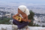 Greece, Athens, Egaleo hill. Son of gypsie singer Kostas Pavlides plays "kitharoni".
 © Maro Kouri