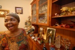 Cezaria Evora in her house: On the shelves, gifts given from her funs all over the world, are in order. "They have no value except that they are full of love", she says. Mindelo, Cape Verde
 © Maro Kouri