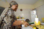 Cezaria Evora in her kitchen:On the large table she puts the delicious local dish ‘cachupa’, salads, fresh fish, and red Portuguese wine. Everybody is welcome, like in a monastery! Mindelo, Cape Verde © Maro Kouri