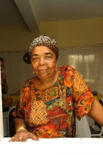 Cezaria Evora in her house, in Mindelo: "As we say in Cape Verde, life consists of poison and honey. Since I took the poison, now, I taste the honey", she tells us.
 © Maro Kouri