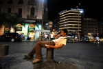 Athens: A man on his chemical nirvana. Midnight at the central Omonoia square: the great drug bazaar.  © Maro Kouri