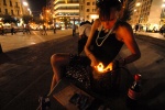 Athens: 22-year old Popi scores her ‘junk‘ every evening in the central Omonoia square. Lack of heroin might stop her two months pregnancy, so, her doctor insists just to reduce it. Opium substance burns at her cigarette. © Maro Kouri