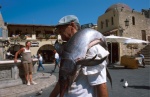 Dodecanese, Rhodes Local fisherman sells lottery tickets  for his sword fish
 © Maro Kouri