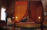 Dodecanese, Rhodes Marco Polo mansion, bedroom, canopy bed, woman lies down
 © Maro Kouri