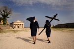 Nurses curry the cross to the chirch of St George, at Easter liany of th epitaph. Corfu city, Greece
 © Maro Kouri
