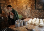 Priest-monk Grigorios Kladis, is the only residence of the the 16th cent.  monastery. He makes cheese, bread, he cultivate vegetables and he helps tor the renovation of the cloister that started the last years.  Island Strofades is 37 sea miles far from Zakynthos. Eptanese, Greece
 © Maro Kouri
