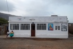 Capo Verde, Sao Vincente, Ribeire Calhao. In the middle of nowhere is a bar with painting portraits of Jesus, Cezaria Evora and other paintings on the walls. © Maro Kouri