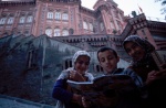 Istanbul, Fanari: Where East Meets West, muslim kids read cartoons in front of the Greek "Red School".  © Maro Kouri