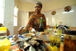 On the large kitchen‘s table Cezaria serves the delicious local dish ‘cachupa’, salads, fresh fish, and some red Portuguese wine. Everyone is welcome, like in a monastery! Mindelo,Cape Verde © Maro Kouri