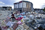 October 22, 2011 - Athens, Greece: Georgia, a gypsy girl sitting on a throne like trashed sofa in the slum. 800 Albanian gypsies live under extreme unhealthy conditions since 2000 in a township on an occupied, private property, only three km below Acropolis. Greek authorities are not able to transfer the gypsies to another legal land in order to gain access to clean water, sanitary and electricity- due to financial crisis. (Maro Kouri / polaris)


 © Maro Kouri